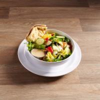 Greek Salad · Iceberg lettuce, tomatoes, cucumbers, feta cheese, dressing, olives, peppershine, and bread.