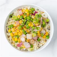 Cauliflower Fried Rice · Roasted cauliflower rice, peas, corn, green onions, and sesame seeds with our house-made gin...