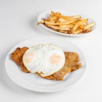 Milanesa (chicken or steak) a caballo · breaded chicken or steak and fried egg