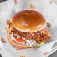Chicken Bomb Sandwich · Half a pound of handcrafted chicken tenders, lettuce, tomatoes, Coleslaw, pickles & bomb sau...