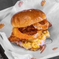 The Mac Bomb Sandwich · Quarter a pound of handcrafted chicken tenders, mac and cheese, onion rings, Buffalo and blu...