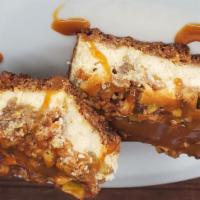 Apple Crisp Cheesecake Bar  · Succulent cheesecake bars made from scratch topped with an apple crisp crumble.