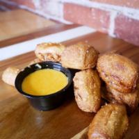 Pretzel Bites Brunch · Pieces of pretzels seasoned with salt. Served with beer cheese or mustard for dipping. Veget...