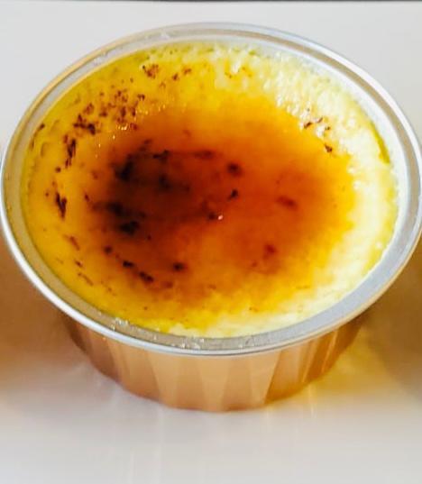Crème Brûlée · Rich custard base topped with a layer of hardened caramelized sugar.