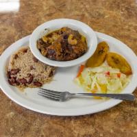 Oxtails · Slow cooked oxtails stewed in a savory sauce. Entree automatically served over red beans and...