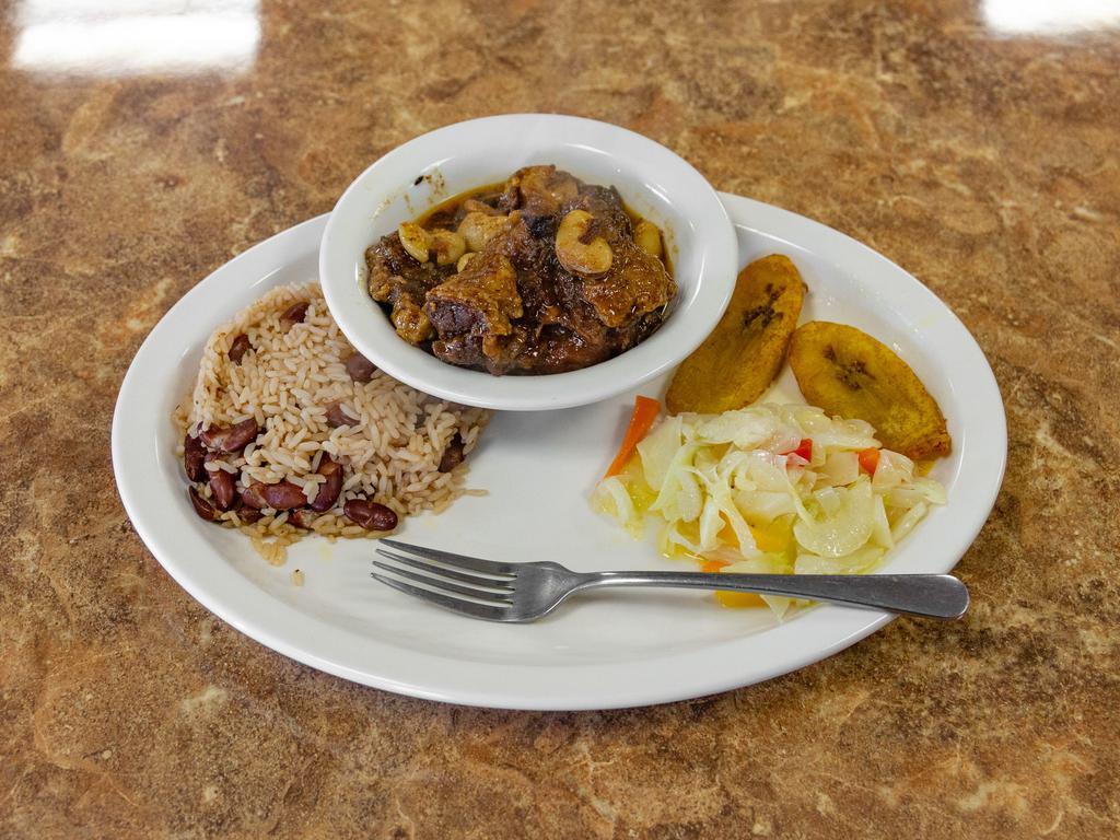 Oxtails · Slow cooked oxtails stewed in a savory sauce. Entree automatically served over red beans and rice, cabbage, and plantain (unless requested otherwise).