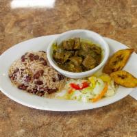 Curry Goat · Stewed goat in an earthy, rich curry flavor. Entree automatically served over red beans and ...