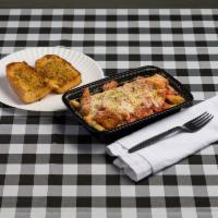 Chicken Parm · Served with baked mozzarella cheese, marinara sauce and side of garlic bread.