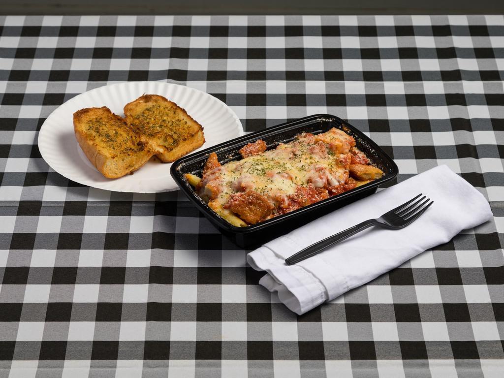 Chicken Parm · Served with baked mozzarella cheese, marinara sauce and side of garlic bread.