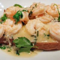 Shrimp Scampi Crostini · Shrimp sautéed in butter, garlic, white wine & fresh herbs, served over grilled focaccia bre...