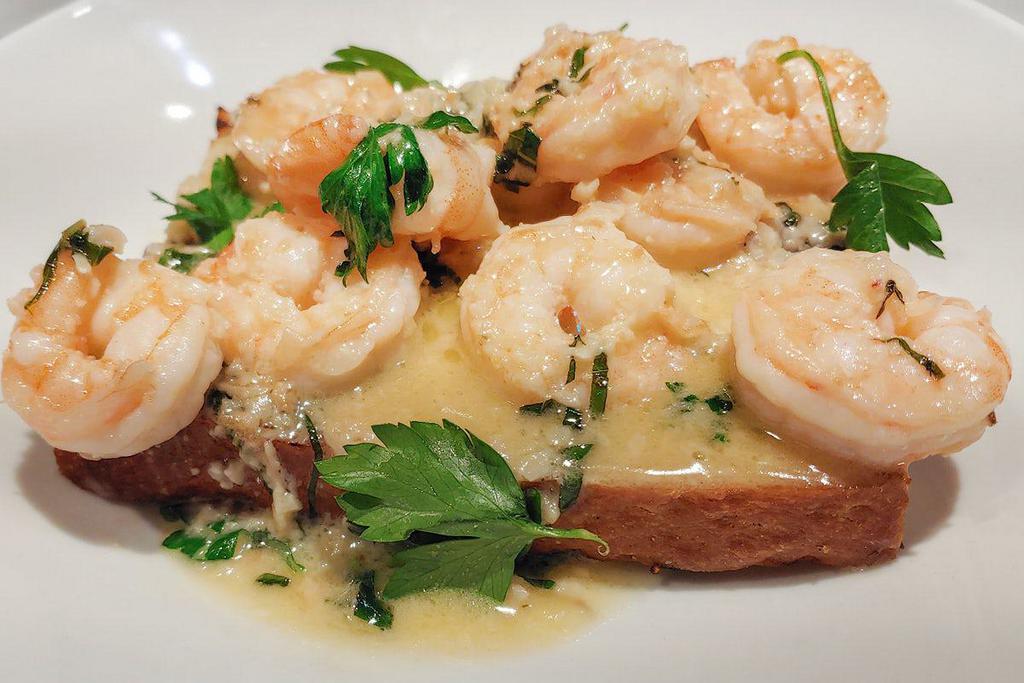 Shrimp Scampi Crostini · Shrimp sauteed in butter, garlic, white wine & fresh herbs,  served over grilled focaccia bread. (450 cal)