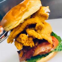 Southern Fried Catfish Tenders on a Toasted Brioche Bun Sandwich · Served with lettuce and tomato with hand cut fries and coleslaw.