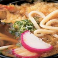 Udon Noodle Soup · Traditional Japanese udon noodle soup with bok choy, fish cake, fried tofu and tempura flake...