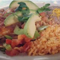 Huevos Rancheros · 2 corn tortillas topped with beans, 2 eggs, and our chile verde pork, served with grilled on...