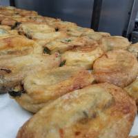 Chile Relleno · A green pasilla chile stuffed with Monterey Jack cheese, rolled in egg batter then fried, se...