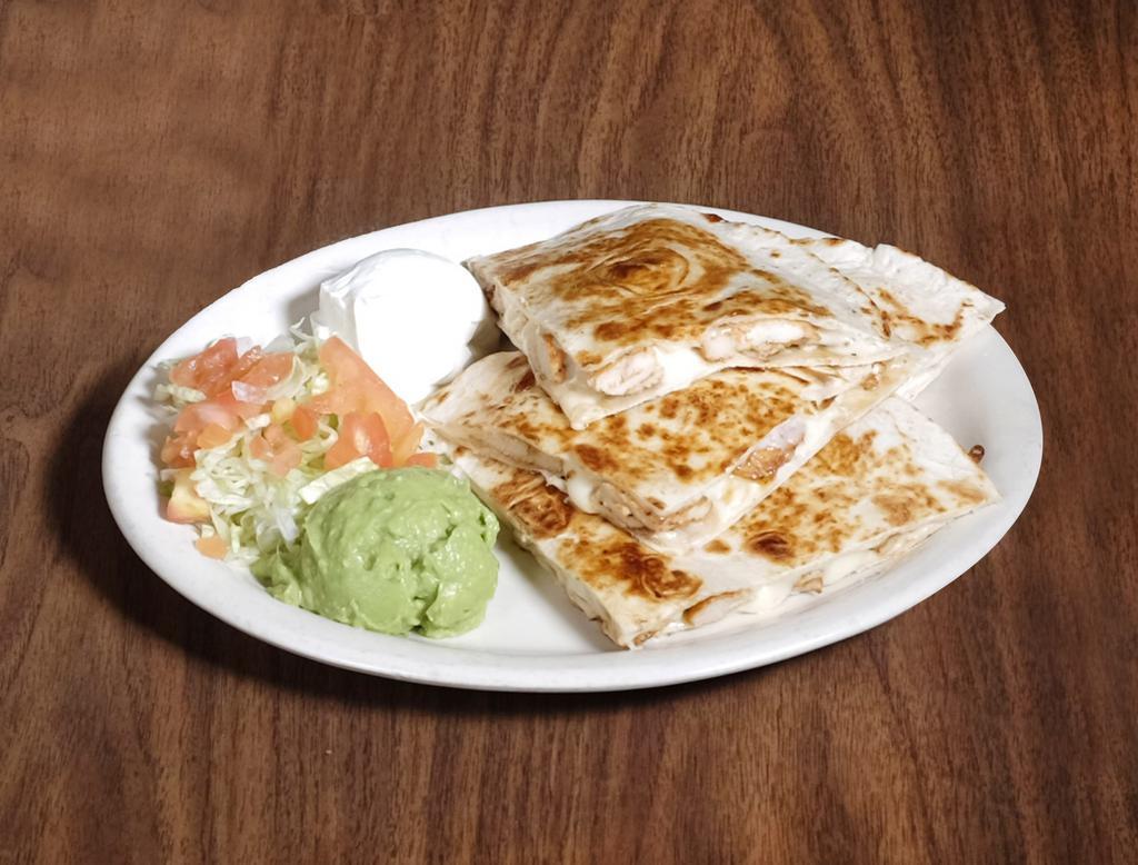 Quesadillas · 2 large flour tortillas, melted mozzarella cheese, served with lettuce, tomatoes, sour cream and guacamole. Add fresh spinach for an additional charge.