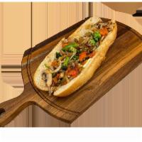 Grilled Veggie Sub · Tomatoes, eggplant, green peppers, onions, mushrooms, broccoli, and cheese.