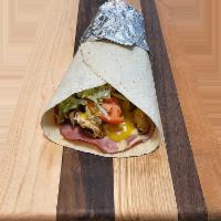 Baby Blue Wrap · Grilled chicken, grilled ham, cheese, lettuce, tomatoes and honey mustard. Served on your ch...