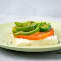 Feta Fournou (Baked Feta Cheese) · Feta cheese baked with a slice of tomato and a slice of green pepper, topped with extra virg...