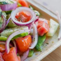 Aggourontomata (Cucumber and Tomato Salad) · Tomatoes, cucumbers, red onions, green peppers, and extra virgin olive oil.