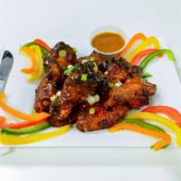Wiri Wings · Seasoned to perfection with a combination of herbs and spices, left to marinade overnight an...