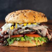 Beef Pastrami · Beef Pastrami on Onion Roll, Topped  With Swiss Cheese, Lettuce, Tomato & Mustard