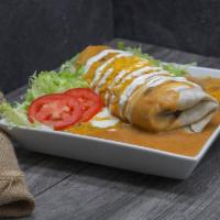 Smothered Burritos  · Your choice of grilled meat with refried beans, mozzarella cheese all wrapped in a warm flou...