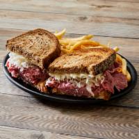 Ruben Sandwich · Served with 1/2 lb. of beef, Swiss cheese, Sour croute and Thousand Island Dressing on Russi...