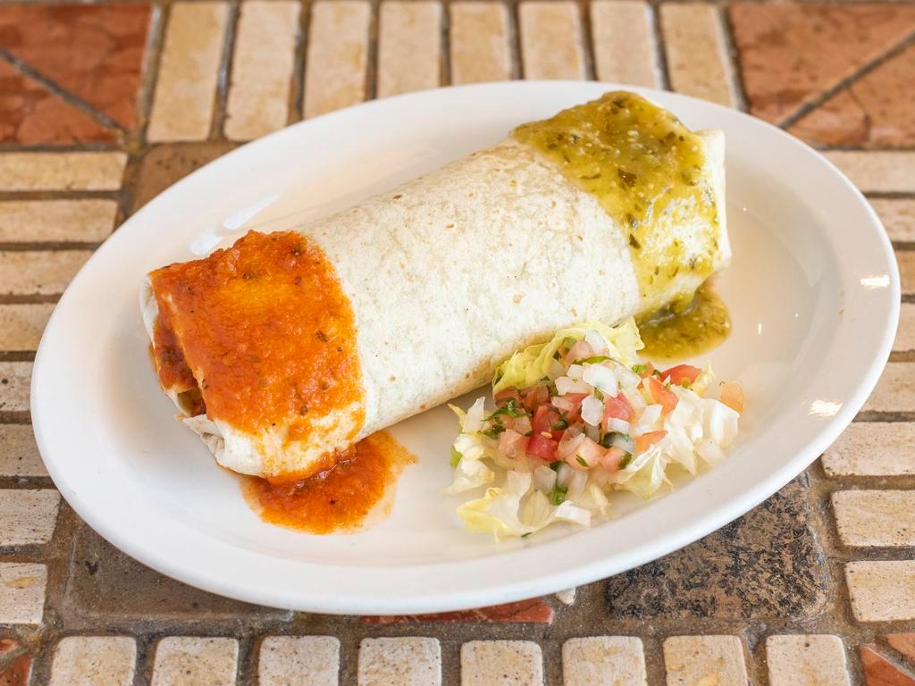 Burrito  · Filled with Mexican rice, refried beans, sour cream cheese, guacamole and pico de gallo.