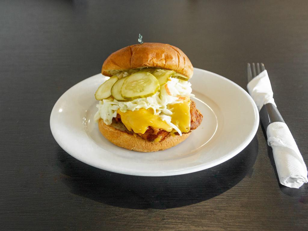 Fried Chicken Sandwich · Served with coleslaw, pickle and American cheese on a bun.