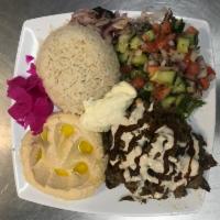 Lamb and Beef Shawarma Plate · Seasoned lamb and beef cooked slowly on a vertical rotisserie and thinly sliced with pickles...