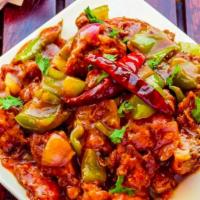Chilli Chicken · Cubes of chicken prepared with corn flour, chili paste, soy and bell peppers. Served with sa...