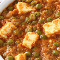Mutter Paneer · Paneer and green peas cooked with cream sauce and spices.