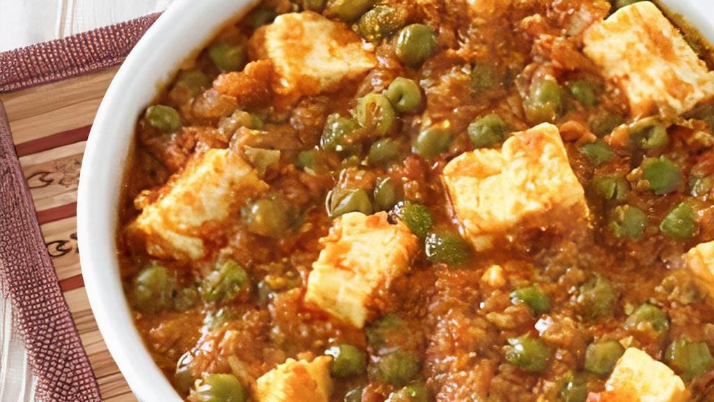 Mutter Paneer · Paneer and green peas cooked with cream sauce and spices.