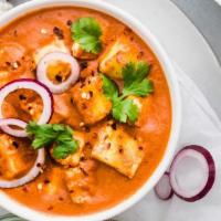Paneer Tikka Masala · Marinated paneer cheese served in a spiced gravy cooked with cream and tomatoes fused with g...