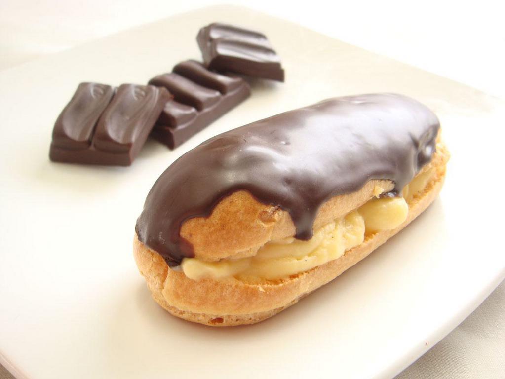 Eclair · Light pastry filled with Bavarian cream and coated with chocolate ganache