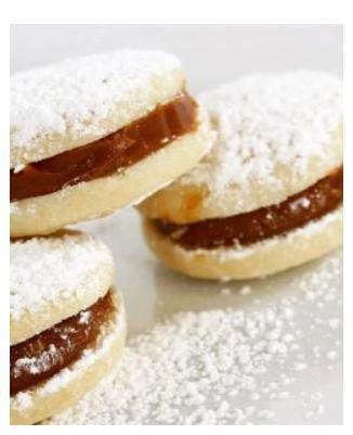 Mini Dulce de leche Alfajor Cookies · 13 count box. Scrumptious South American style shortbread cookie sandwiches that are filled with our signature dulce de leche (caramel) and drenched in confectioners’ sugar. These cookies will keep you coming back!