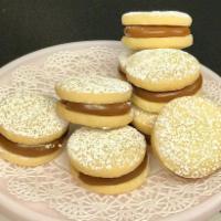 Large Dulce de Leche Alfajor Cookie · Scrumptious South American style shortbread cookie sandwiches that are filled with our signa...