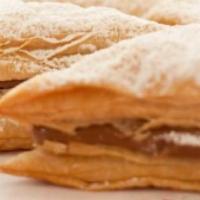 Dulce de Leche Napoleon · Flaky pastry filled with creamy dulce de leche and dusted with powdered sugar