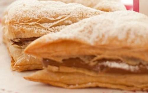 Dulce de Leche Napoleon · Flaky pastry filled with creamy dulce de leche and dusted with powdered sugar
