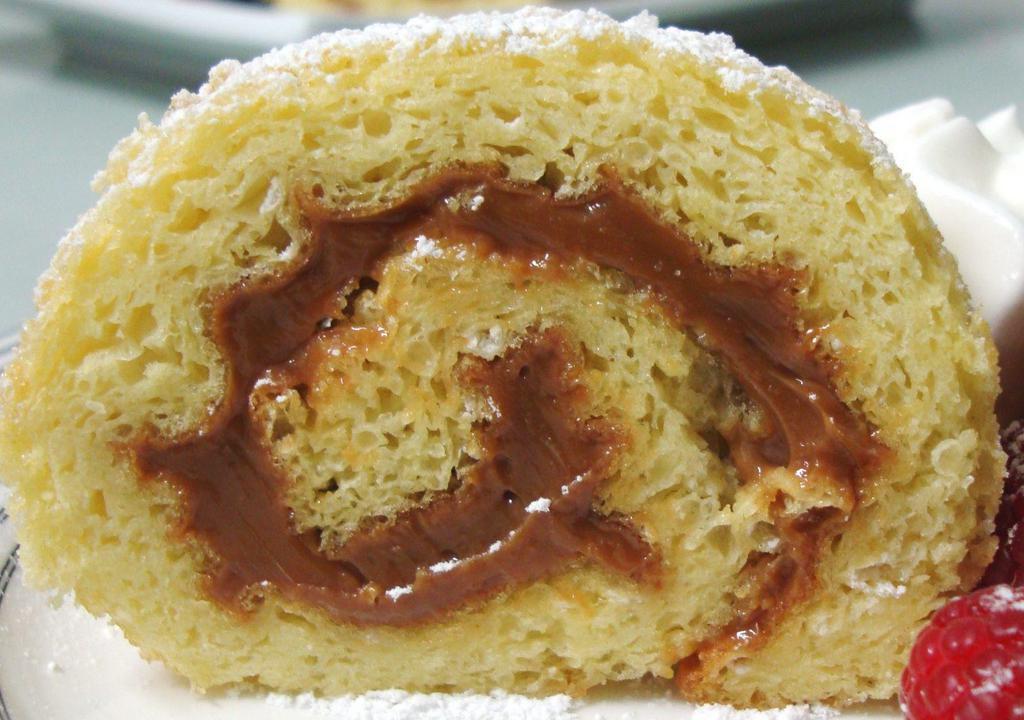 Pionono · Delicate sponge cake roll filled with dulce de leche filling. 2   1-inch slices