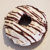 Mocha Coffee Cake · Specialty - Coffee infused chocolate cake donut, topped w/coffee buttercream and chocolate g...