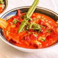 Butter Chicken · Tandoori chicken cooked in our signature sauce.  Served with rice.