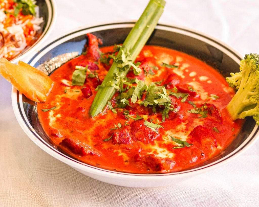 Butter Chicken · Tandoori chicken cooked in our signature sauce.  Served with rice.