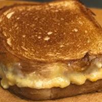 Cheesy Street Grill Signature Grilled Cheese · Asiago, goat and sharp cheddar cheeses.