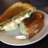 Caprese Grilled Cheese · Mozzarella, tomatoes and pesto or balsamic reductions.