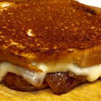 The French Onion Grilled Cheese · Swiss cheese and red wine caramelized onions.