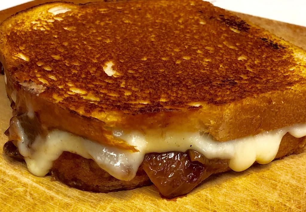 The French Onion Grilled Cheese · Swiss cheese and red wine caramelized onions.