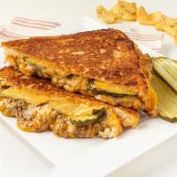 The Big Melt Grilled Cheese · Ground Beef, cheddar cheese, pickles and Thousand Island dressing.