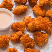 Popcorm Chicken · Bite-sized pieces of chicken. Breaded and fried. Toss them in your favorite sauce. 